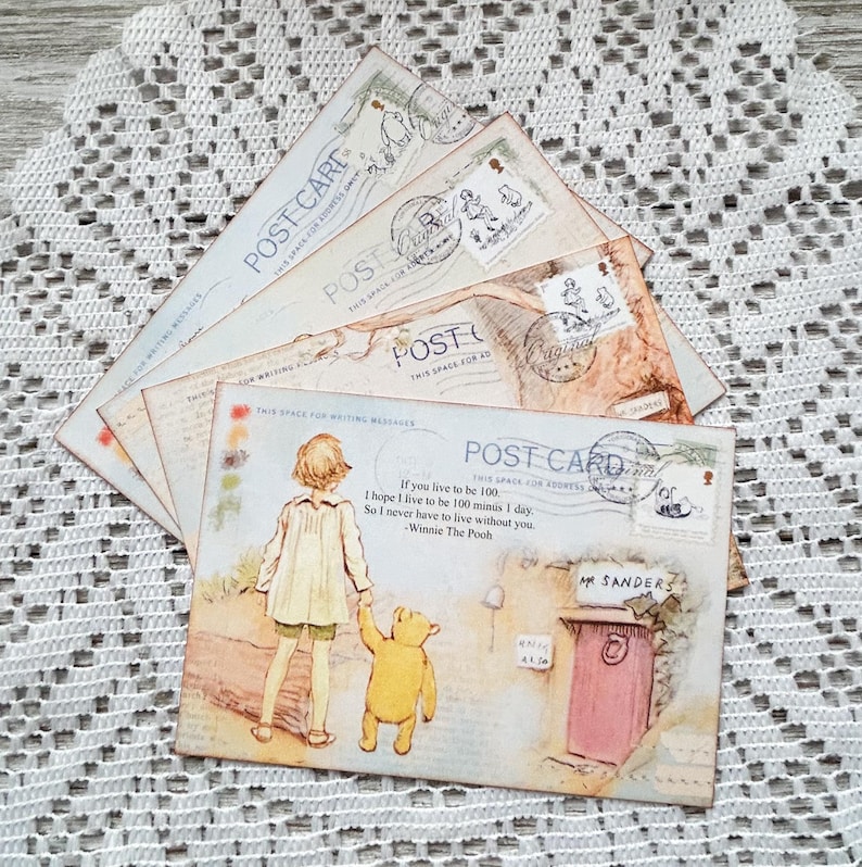 May include: A set of four vintage-style postcards featuring a drawing of Winnie the Pooh and Piglet walking together. The postcards have a light blue background with a quote from Winnie the Pooh: "If you live to be 100, I hope I live to be 100 minus 1 day. So I never have to live without you." - Winnie the Pooh.