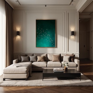 May include: A modern living room with a large beige sectional sofa, throw pillows, and a dark wood coffee table. A large framed artwork with a green and teal abstract design hangs above the sofa. The room has a neutral color palette with warm lighting.
