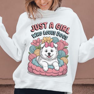 Cute Samoyed Puppy PNG  Cartoon White Dog in Pink Bed with Yarn & Flowers Sublimation Clipart for Kids and Pet Lovers