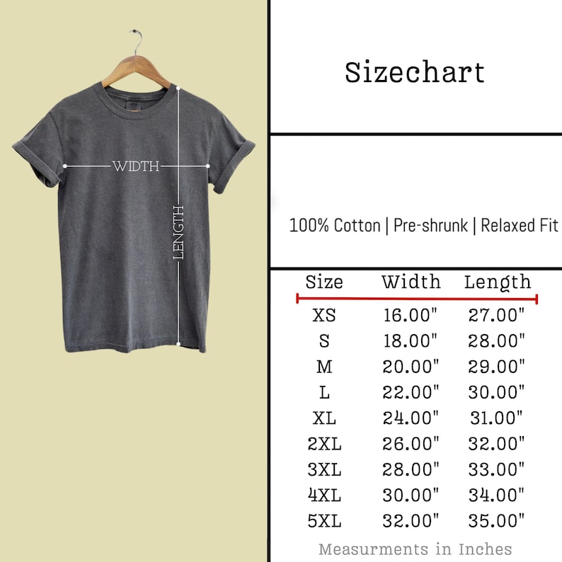 May include: A dark gray t-shirt hanging on a wooden hanger. The image includes a size chart with measurements in inches for sizes XS to 5XL. The shirt is made of 100% cotton, pre-shrunk, and has a relaxed fit.