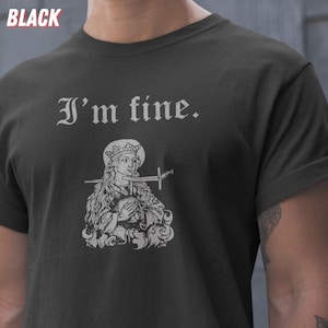May include: Black t-shirt with the text "I'm fine." above a graphic of a woman with a sword through her mouth. The word "BLACK" is in the upper left corner of the image.