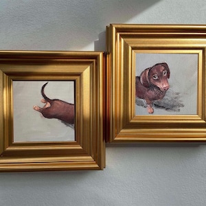 May include: Two square paintings in ornate gold frames. The left painting shows the rear end and tail of a brown dachshund. The right painting depicts the head and front body of a brown dachshund looking towards the left against a light background.