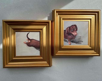 May include: Two square paintings in ornate gold frames. The left painting shows the rear end and tail of a brown dachshund. The right painting depicts the head and front body of a brown dachshund looking toward the left against a light background.