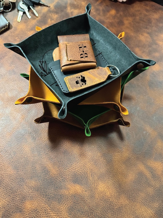 Hand-stitched real leather catchall tray, laser-engraved with custom text — the kind of desk/dresser staple that actually looks like it cost three times more.