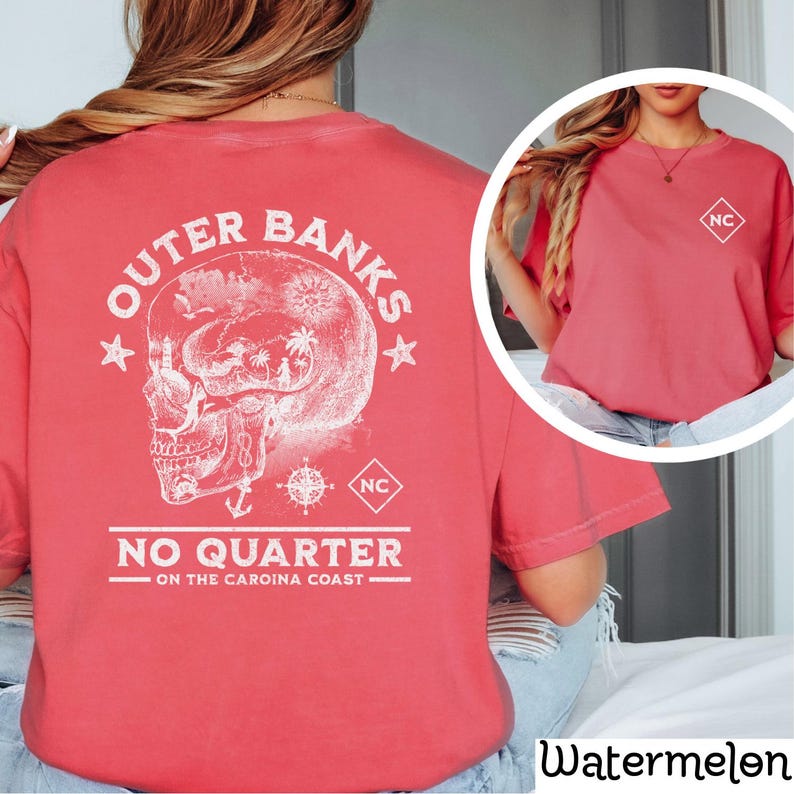 May include: Red t-shirt with a white graphic of a skull with a compass and anchor. The text "Outer Banks No Quarter On The Carolina Coast" is printed on the shirt.