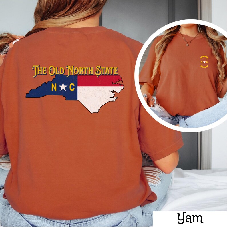 May include: A burnt orange t-shirt with a graphic of the state of North Carolina on the back. The graphic includes the words "The Old North State" and "N*C" in a vintage style font.