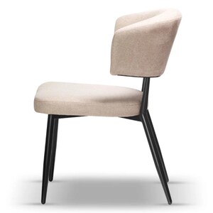 May include: A beige upholstered dining chair with a curved back and black metal legs.
