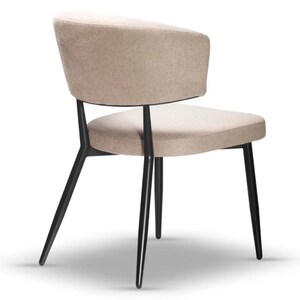 May include: A beige upholstered chair with a curved back and black metal legs. The chair has a simple, modern design.