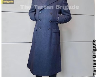 May include: A navy blue double-breasted overcoat with a long, tailored silhouette. The coat features large buttons, pockets, and a classic lapel design. The text "The Tartan Brigade" is visible on the coat.