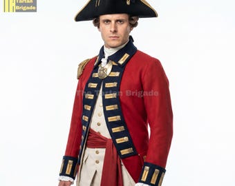May include: A red military-style coat with dark blue lapels, gold-tone buttons, and gold trim, worn with a white waistcoat, a red sash, and a black tricorne hat. The text The Tartan Brigade is visible in the upper left corner and across the chest.
