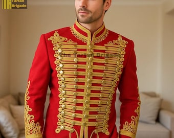 May include: A red military-style jacket with gold-colored embroidery and buttons. The jacket features a high collar and decorative gold trim. The text "The Tartan Brigade" is visible in the upper left corner. This jacket is a statement piece.