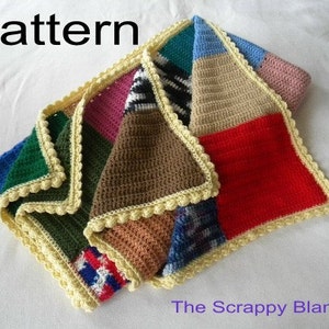 May include: A multi-colored crocheted blanket with a yellow crocheted border. The blanket is made of squares of different colors and patterns. The text "The Scrappy Blanket" is visible in the bottom right corner of the image.