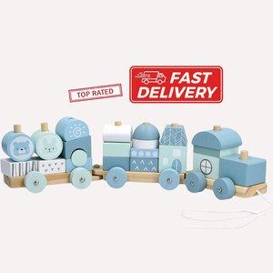 May include: A wooden toy train in shades of blue, white, and natural wood. The train features various block shapes, including a bear, bunny, and house designs. The train has wheels and a string for pulling. The image also includes a "Fast Delivery" sign.