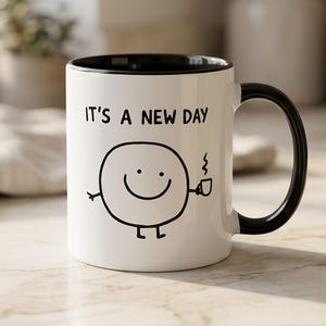 Taza "Es un nuevo día" – Bonita taza de café minimalista con una sonrisa, regalo positivo para ella.