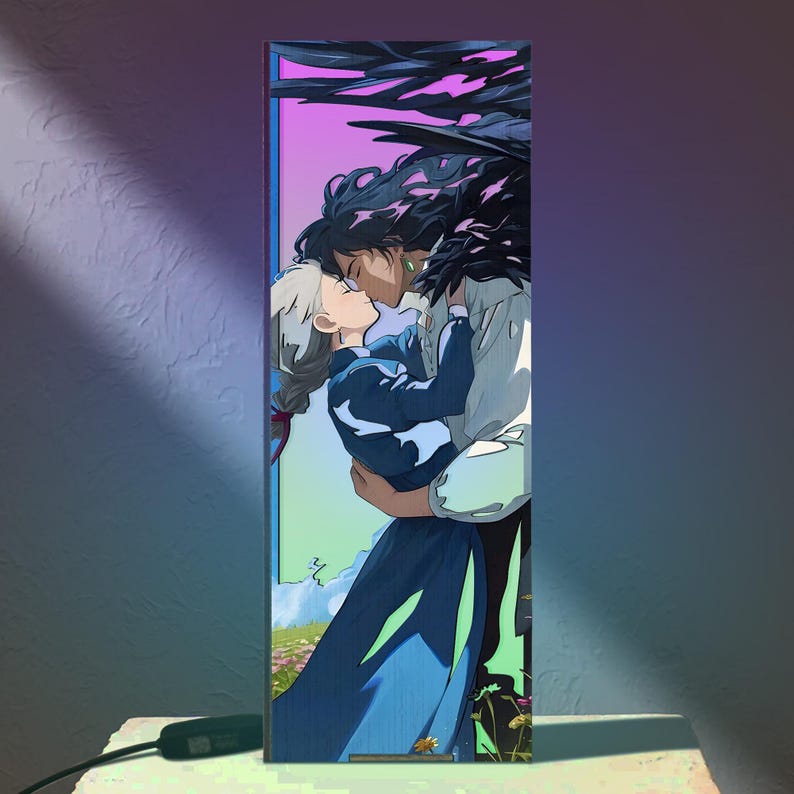 May include: A rectangular lamp featuring an anime-style illustration of two figures embracing and kissing. The artwork has a vibrant color palette with a purple and pink gradient background. The figures are in a romantic embrace, with one figure in a blue dress.