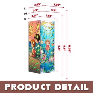 May include: A rectangular lamp featuring two distinct illustrated panels. One side shows two figures on a beach at sunset. The other side depicts a character underwater with fish and coral. Dimensions are labeled as 3.14, 3.5, and 3.93 inches wide, and 8.6, 9.8, and 11.02 inches tall.