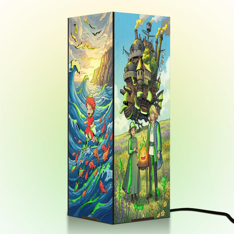 May include: A rectangular table lamp featuring vibrant anime-style illustrations on its sides. One side depicts a character running through ocean waves with orange fish, while the other shows a large mechanical castle and two figures with a fire spirit.