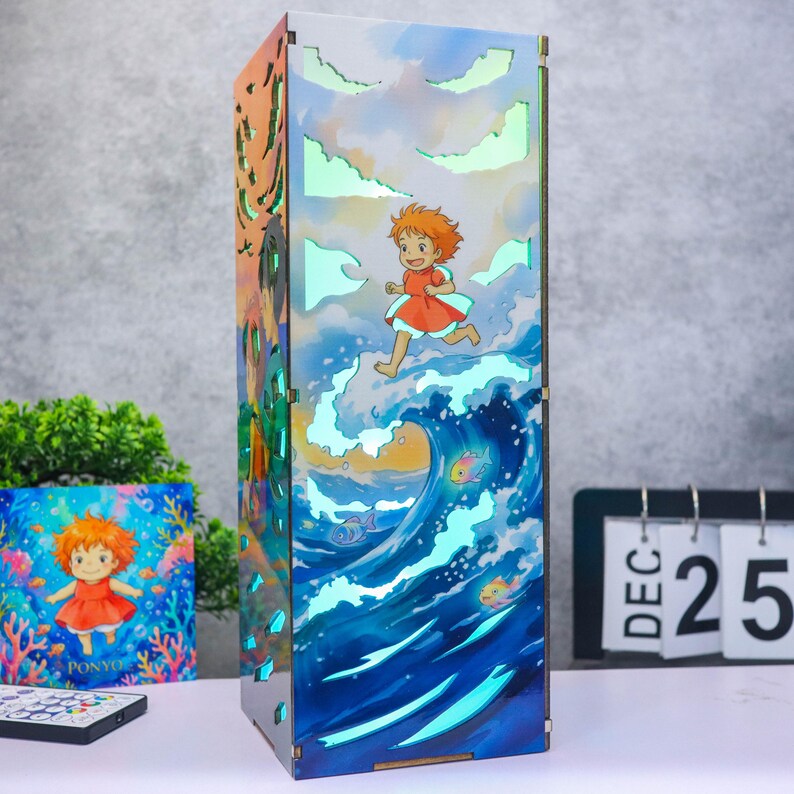 May include: A rectangular light box featuring a colorful illustration of a character with orange hair in a red dress running across ocean waves. The design includes cut-out cloud shapes that emit a soft light, with fish swimming in the blue water.