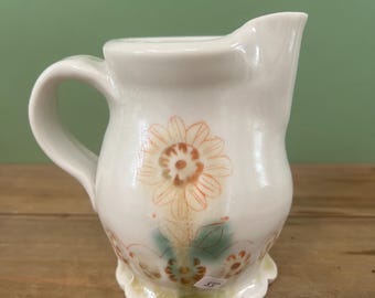 Handmade Porcelain Creamer, white with orange inlaid drawings, yellow accent.