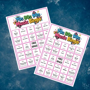 May include: Two 70s, 80s, 90s Music Bingo game cards. Each card has a pink border and features song titles from the 70s, 80s, and 90s. The top of each card reads "70s 80s 90s Music Bingo" in colourful text.