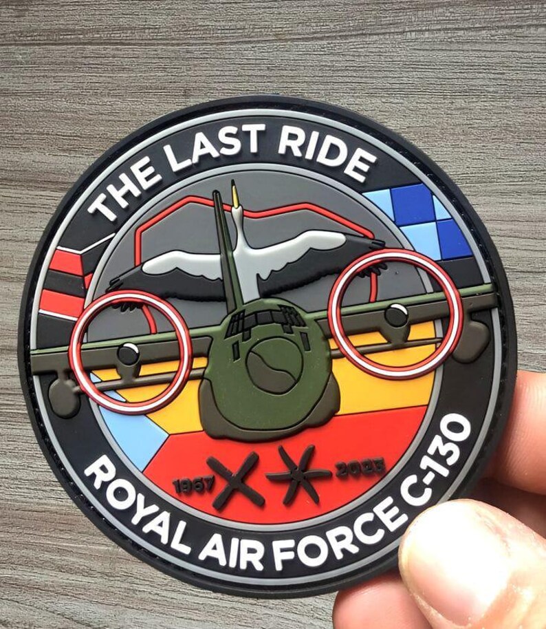 May include: Circular patch with the text "THE LAST RIDE" and "ROYAL AIR FORCE C-130". The patch features a stylized aircraft, a bird, and dates 1957 and 2023. The patch has a black border with red, yellow, and blue accents.