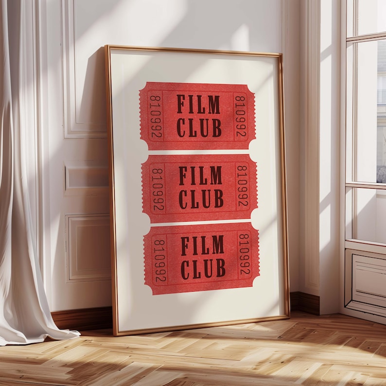 May include: A framed print with three red tickets that say "Film Club" in black text. The tickets have the number 810992 printed on them.