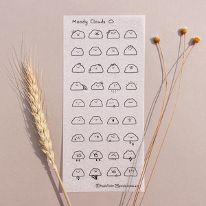 May include: A rectangular sticker sheet titled Moody Clouds featuring a grid of thirty-two small black and white line art illustrations of clouds with various facial expressions and weather patterns, including rain, sun, and lightning bolts.