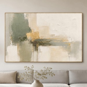 May include: A large rectangular abstract painting featuring layered brushstrokes in shades of sage green, cream, beige, and metallic gold. The composition displays a textured, horizontal orientation with blended colour blocks and subtle gold accents.