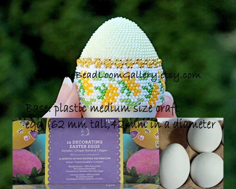 May include: A decorative Easter egg, 62 mm tall and 42 mm in diameter, with a beaded design. The top is covered in small white beads, with a gold band. The base features a pattern of yellow and green beads. The image also shows a box of decorating Easter eggs.