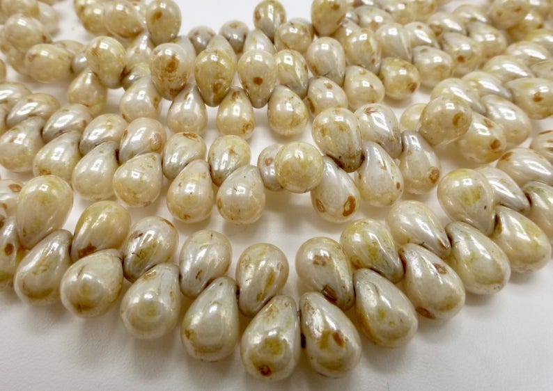 100 Czech Glass Tiny Tear Drop Beads in a Opaque Cream Luster with Picasso Finish Size 4x6mm