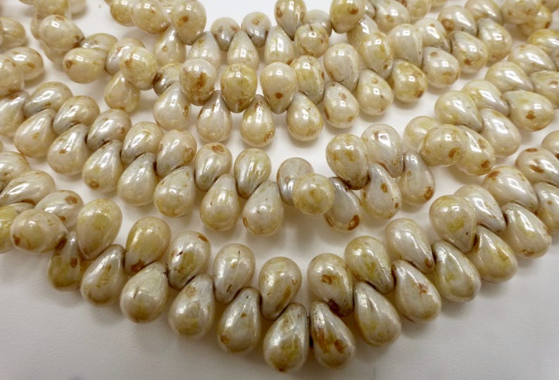 100 Czech Glass Tiny Tear Drop Beads in a Opaque Cream Luster with Picasso Finish Size 4x6mm