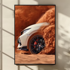 May include: A framed print featuring a cream-colored sports car partially submerged in a cloud of reddish-brown sand. The car's black wheel with a red accent is visible, along with the Honda logo. The image evokes speed and adventure.