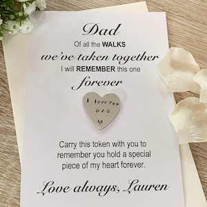 May include: A white card with a silver heart charm attached. The card reads "Dad, Of all the WALKS we've taken together I will REMEMBER this one forever. I love you DAD. Carry this token with you to remember you hold a special piece of my heart forever. Love always, Lauren."