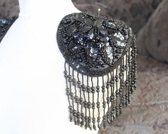 Cute beaded and embroidered applique with sequence black color 1 pieces listing 5 1/2 inches in diameter 4 inch long beading