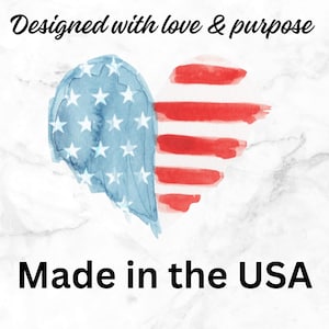 Watercolor American flag heart on a marble background with text reading “Designed with love & purpose” and “Made in the USA,” highlighting handmade American-made greeting cards and stationery.