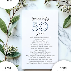 May include: A white rectangular greeting card featuring the text You're Fifty, the number 50 in blue, the name Jered, and a poem about turning fifty. The card includes a kraft envelope and is presented with decorative green leaves and white flowers.