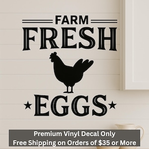 May include: Black and white vinyl decal with the text "FARM FRESH *EGGS*" and a silhouette of a chicken. The decal is on a white wood background.