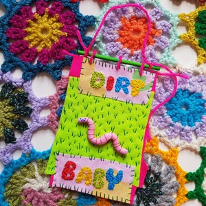 dirt baby worm wall hanging