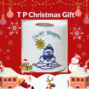 May include: A white toilet paper roll featuring an embroidered design of a melting snowman wearing a blue hat and mittens, a yellow sun, and the green text Slush! Happens. The roll has a textured surface and a hollow cardboard centre core.