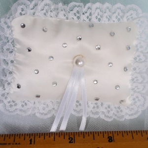 1 small wedding ring pillows, 3X4 inch rectangle shape, WHITE satin fabric, White ribbons FIRMLY attached to tie 2 rings onto the pillow