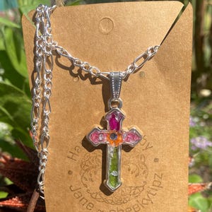 Cross necklace with real flowers.