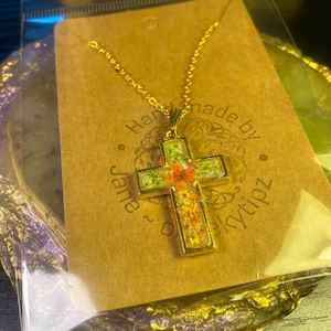 Cross necklace with real flowers. One of a kind.