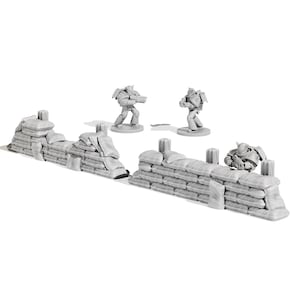 May include: A miniature war game scene featuring two sandbag walls and three futuristic soldier figurines. The sandbag walls are light gray, and the soldiers are in a similar color. The scene is set against a white background.
