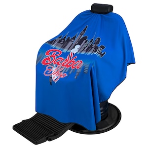 Regale Barber Supply Stylish City Cape With Barber Shop Lettering and Classic Barber Pole