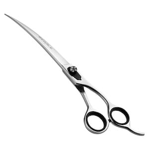 May include: Curved stainless steel grooming shears with black finger inserts. The shears have a curved blade and the word "REGALE" is printed on the blade. The shears are designed for professional pet grooming.