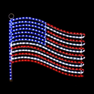 May include: A decorative American flag made of red, white, and blue LED lights. The flag is waving, with the stars and stripes design clearly visible. The lights are arranged to mimic the appearance of a waving flag, perfect for patriotic displays.
