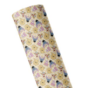 May include: A roll of fabric featuring a repeating pattern of Winnie the Pooh, Piglet, Tigger, and Eeyore character faces. The background consists of a light yellow and white gingham check design, creating a soft, light-colored aesthetic.