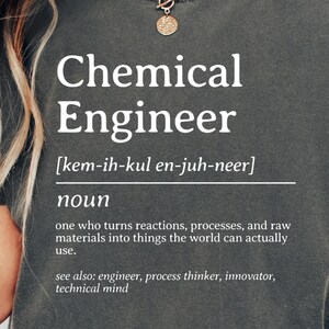 May include: A dark grey unisex t-shirt with the words "Chemical Engineer" in white, along with a definition and phonetic pronunciation. The shirt includes related terms. The shirt is labelled "Pepper".