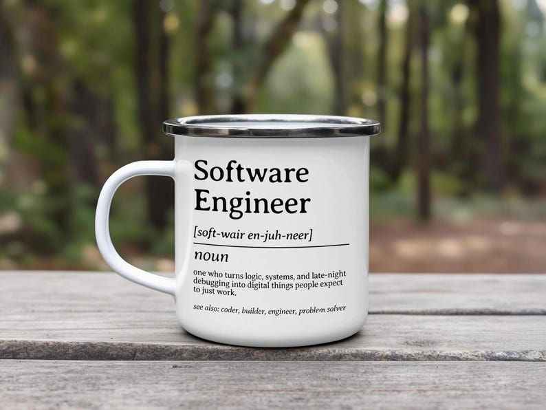 Enamel mug with definition of "Software Engineer" in black text.