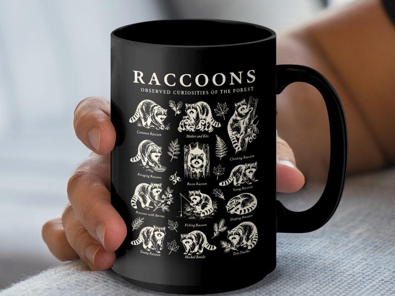 Black mug with an illustration of various raccoons and their descriptions.